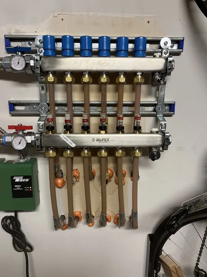 Plumber performing Gas Line Installation at a residential property in Saranac